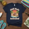 Chill Mode Activated T-Shirt with a red panda relaxing in a hammock on a tropical beach, sunset background