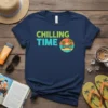 Navy t-shirt with "CHILLING TIME" text and a tropical beach scene with palm trees and a hammock