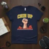 Chin Up text with a powerful fist breaking through rocks graphic on a navy blue t-shirt