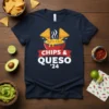 Navy blue t-shirt with "CHIPS & QUESO '24" text and graphic of tortilla chips dipping into a bowl of queso