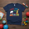 Navy blue t-shirt with "CHOO CHOO! I'M 2" text and a colorful train graphic, celebrating a second birthday