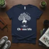 Choose Life text with red heart symbol and a tree growing from a heart graphic on a navy t-shirt