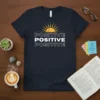 Choose Positive Positive Positive text design with a sun graphic on a navy blue t-shirt
