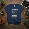 Choose to keep writing your Story t-shirt with an open book graphic and celestial elements