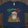 Christmas Cat text with a cute grey cat wearing a Santa hat, surrounded by Christmas trees and presents, on a
