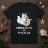 Christmas Is Magical t-shirt with a cute fox detective holding a magnifying glass and a scroll, surrounded by stars