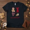 Christmas Wishlist T-Shirt with Santa teddy bear, red bow, candy cane, and winter boot graphic