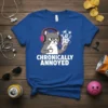 Chronically Annoyed cat wearing headphones holding coffee and phone, white text on blue t-shirt