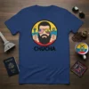 Navy blue t-shirt with bold black text "CHUCHA" and a circular graphic of a bearded man wearing sunglasses with US