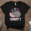 Black t-shirt with "CHUT !" text and a cute sleeping grey cat on a pink pillow, "Zzz" above it