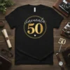 Black t-shirt with "cincuenta 50" in gold lettering inside a gold circle, and a small white heart