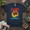 Claws Cat Lovers Against White Supremacy text design with a black cat silhouette in a circle, on a navy t-shirt