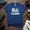 Blue t-shirt with the word CLERK in white, above an icon of an open book with gears and a person