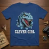 Clever Girl T-Shirt with a blue raptor dinosaur bursting through a torn background