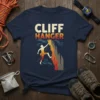 CLIFF HANGER t-shirt with a graphic of a rock climber scaling a cliff face