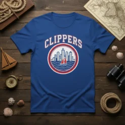 Royal blue t-shirt with 'CLIPPERS' text above a circular logo featuring a city skyline and a sailboat in the water