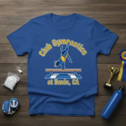 Blue t-shirt with "Club Gymnastics at Davis, CA" text and a cow doing a handstand on a balance beam graphic