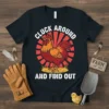 Black t-shirt with "Cluck Around And Find Out" text and a cartoon rooster graphic