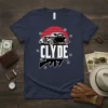 Clyde T-Shirt featuring a black vintage car, the name CLYDE in white text, and a silhouette of a tommy gun