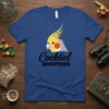 Cocktiel Whisperer t-shirt with a cute cockatiel graphic and black text