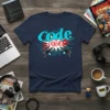 Navy blue t-shirt featuring the text "code SUPERHERO" in stylized blue and red fonts, with graphics of circuit boards and