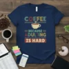 Coffee Because Adulting Is Hard quote on a navy blue t-shirt with a coffee cup graphic