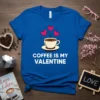 Blue t-shirt with white text "Coffee Is My Valentine" above a cup of coffee with hearts