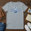 Grey t-shirt featuring the Colby College logo with a graduation cap, open book, and a running husky mascot in blue