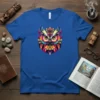 Colorful geometric owl graphic design with intricate patterns and vibrant hues on a blue t-shirt