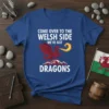 Come Over To The Welsh Side We've Got Dragons text with a red dragon breathing fire over mountains on a