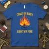 Royal blue t-shirt with "Come On Baby Light My Fire" text and a stylized menorah with flames graphic for Hanukkah
