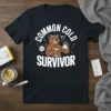 Common Cold Survivor T-Shirt with a cartoon bear holding tissues and a virus graphic
