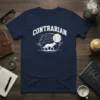 Navy blue t-shirt with "CONTRARIAN" text above a white wolf graphic walking under a moon and flock of birds