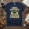 Cool Brothers Play Chess t-shirt design with knights on a chessboard. Features bold text and a playful graphic for brotherly