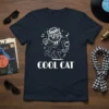 Cool Cat graphic t-shirt design with a white outline of a cat wearing a hat and suit, dancing to music
