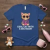 Cool Cat With A Big Heart text on a blue t-shirt featuring a cartoon cat wearing sunglasses and holding a
