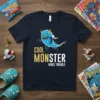 Cool Monster Make Trouble text with a blue cartoon monster graphic on a navy t-shirt
