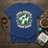 Cool People Have Dogs text and silhouette graphic on a navy blue t-shirt, featuring paw prints and stars
