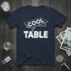 Cool Table humorous quote design with bold white text on a navy blue t-shirt