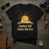 Coolest Cat Under the Sun text with a cheetah graphic lying in front of a sun on a black t-shirt