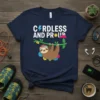 Cordless and Proud text with a cute sloth hanging on a branch graphic on a navy t-shirt