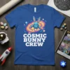 Cosmic Bunny Crew text with a cartoon bunny in a spaceship in a galaxy background on a blue t-shirt