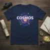Navy t-shirt with the word COSMOS in white letters surrounded by a colorful, swirling galaxy graphic with planets and stars