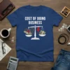 Cost of Doing Business t-shirt design featuring a balance scale with money, gears, and a lightning bolt