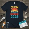 Cousin Cruise 2026 text with a sunset, palm trees, and cruise ship graphic on a navy t-shirt