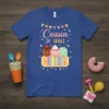 Blue t-shirt with "Cousin of Three" text, ice cream scoops, and ticket graphic