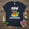Cow Life Is Beachy t-shirt design with a cow wearing sunglasses on a pineapple float