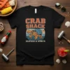 Crab Shack Seafood & Spirits t-shirt design featuring a hermit crab and retro sunset graphic