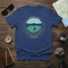 Crater Lake Depth 1,949 T-Shirt design featuring a circular graphic of the lake, Wizard Island, and surrounding forest with depth
