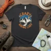 Crazy Hiking Lady t-shirt design featuring a silhouette of a hiker ascending a mountain path within a circular graphic